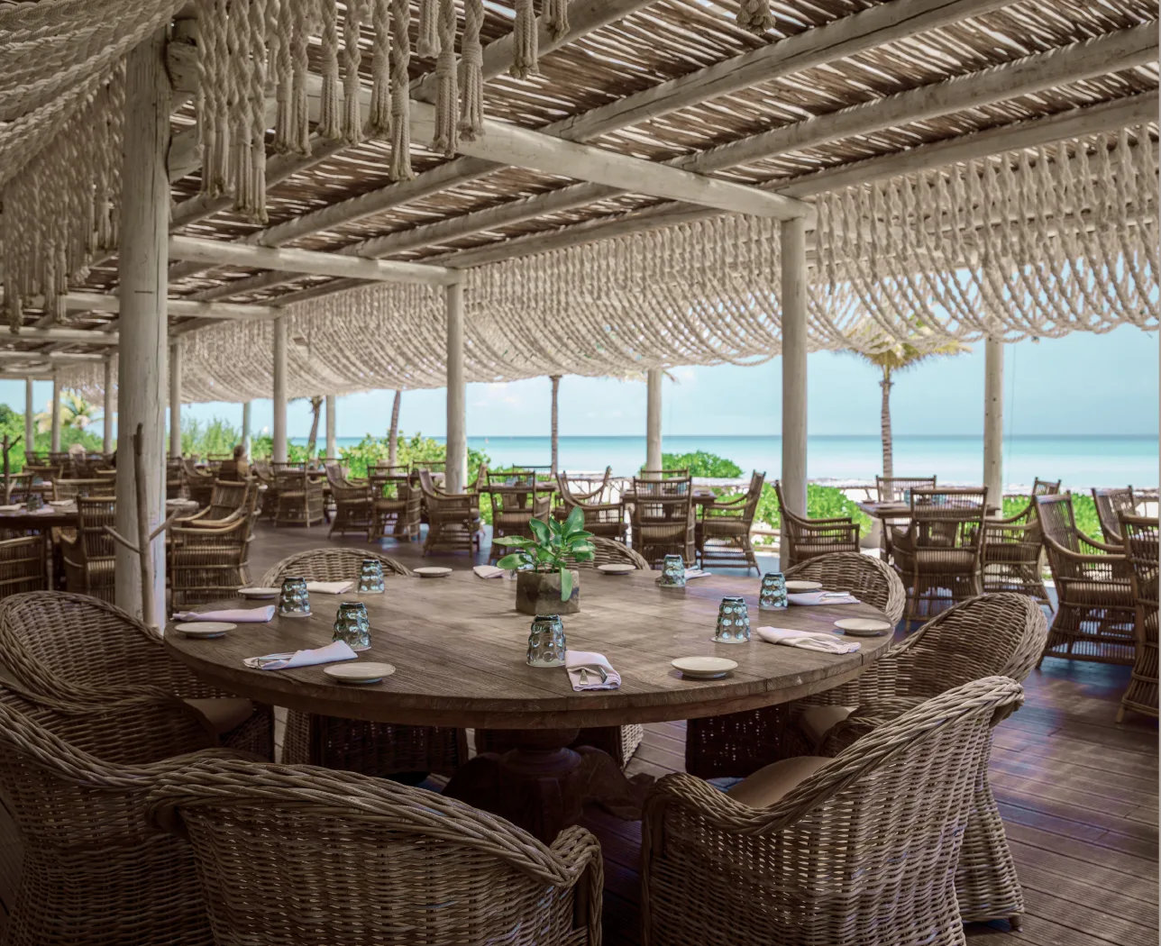 Open-air dining room with macramé ceiling